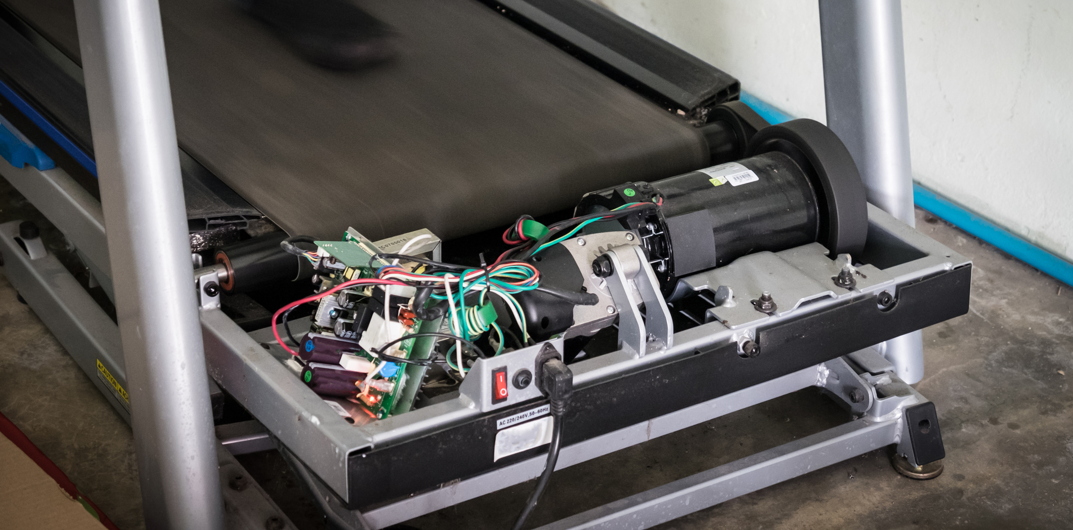 Treadmill repair showing internal mechanisms